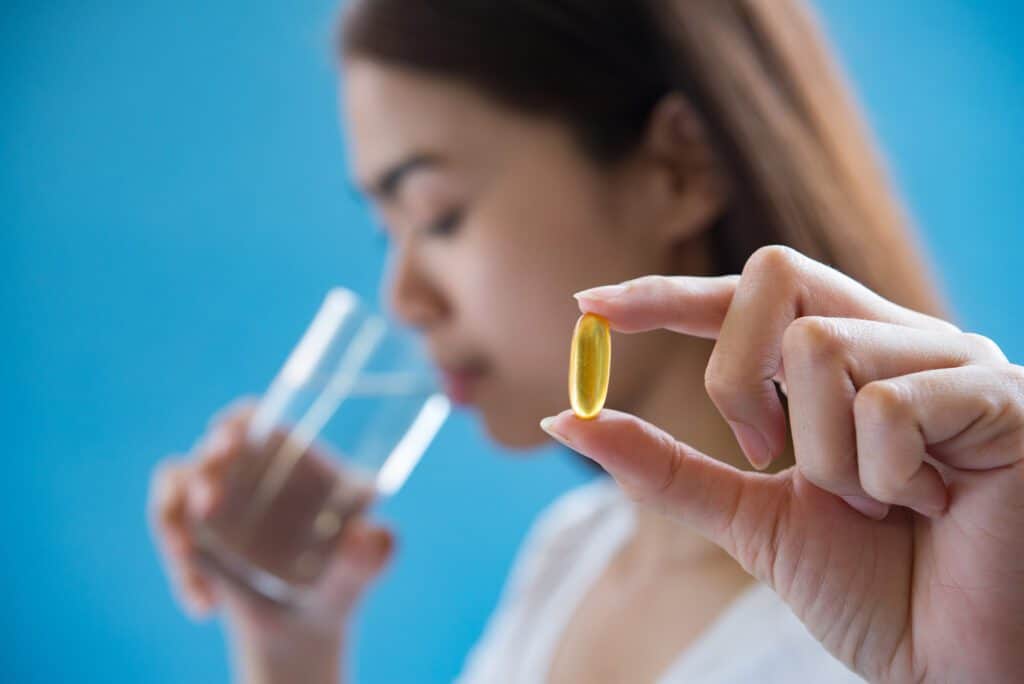 Woman Hand Holding A Pills Take Medicine According To The Doctor's Order